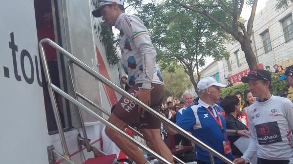 Nicolas Roche (Ag2r-La Mondiale) climbs onto the podium ahead of Ben King (RadioShack).