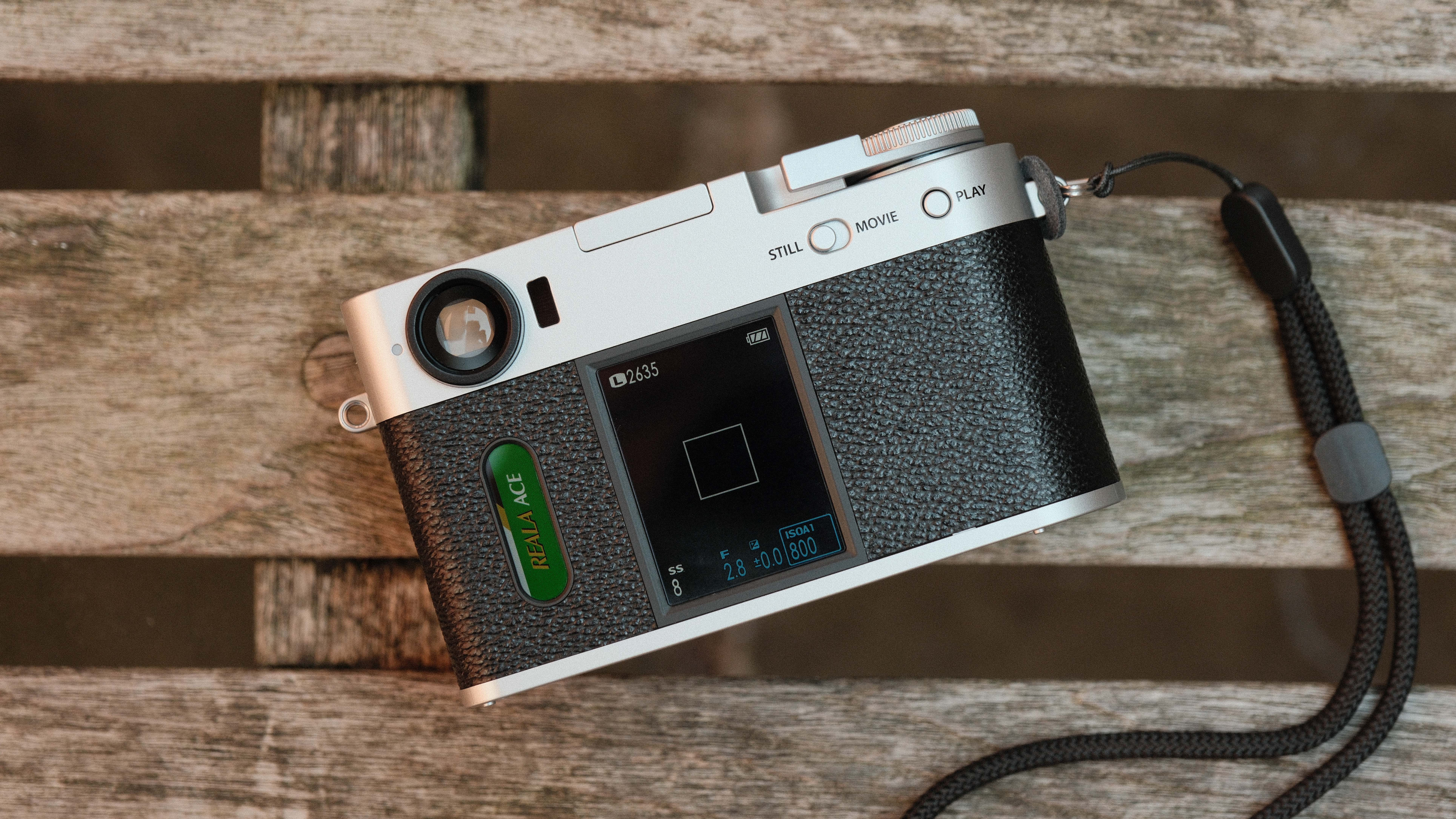 Fujifilm X Half camera on a wooden bench