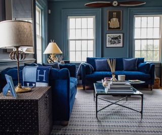 living room with velvet blue sofas