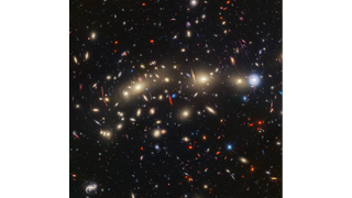 a smattering of galaxies seen as countless dots of light