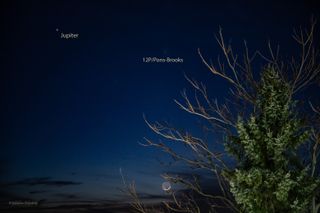 a fuzzy orb in the sky next to a bright moon and a brighter orb, jupiter