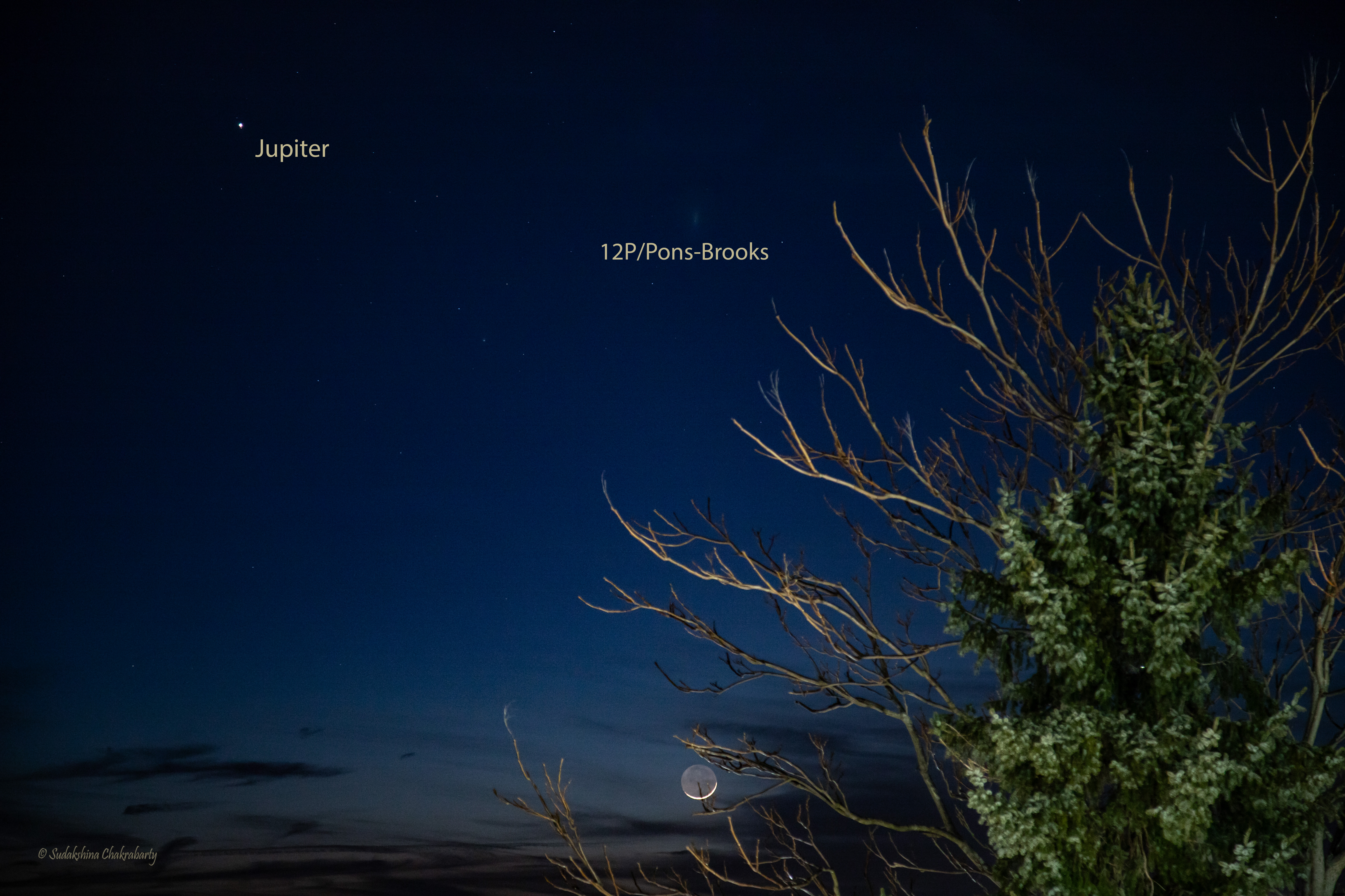 a fuzzy orb in the sky next to a bright moon and a brighter orb, jupiter