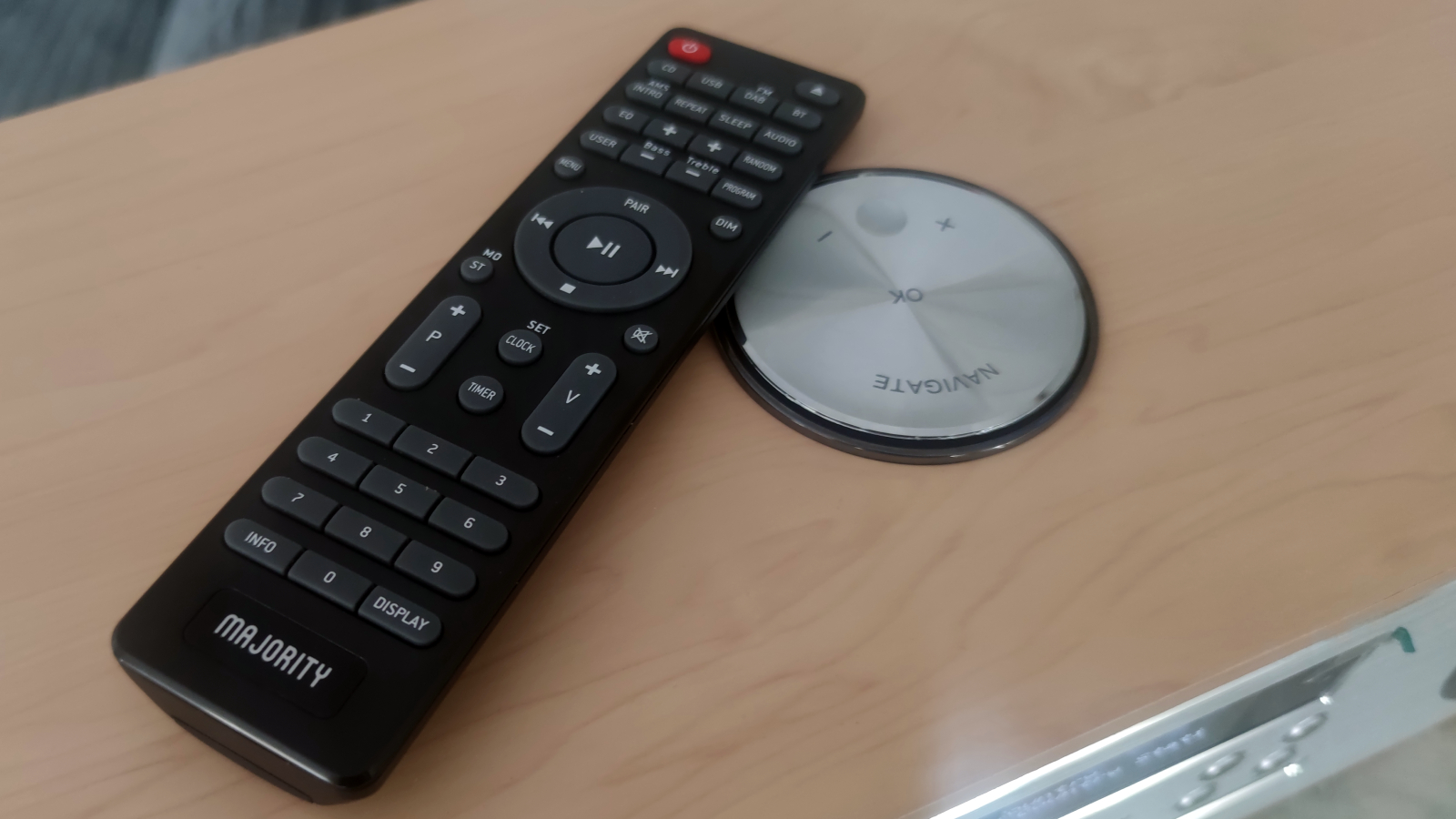 The Majority Oakington's remote by its volume dial