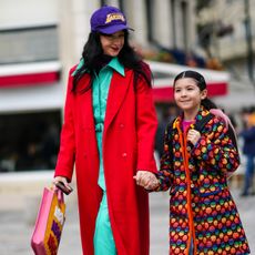 Mother and daughter walking down the street