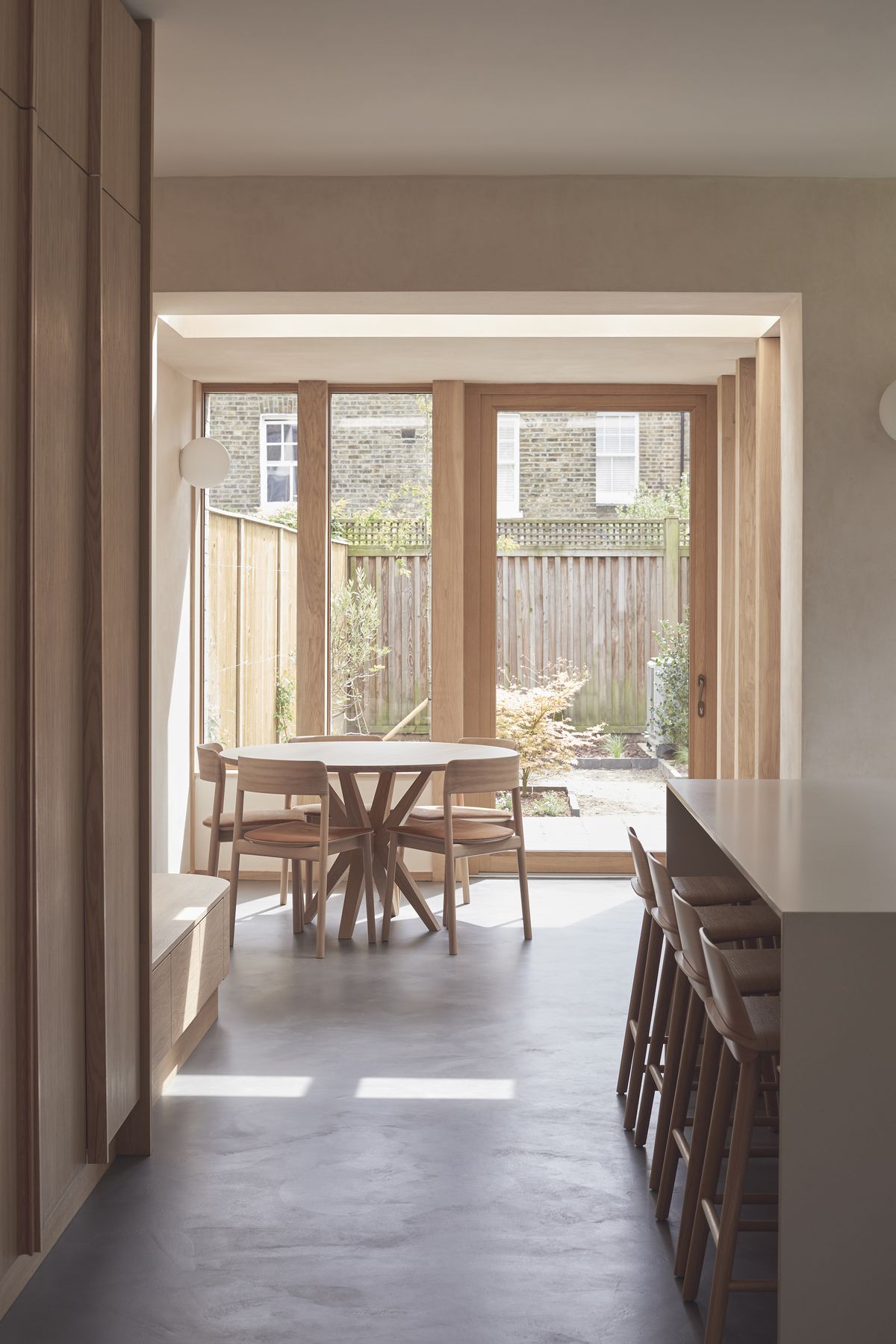 view to garden through timber windows in dining room