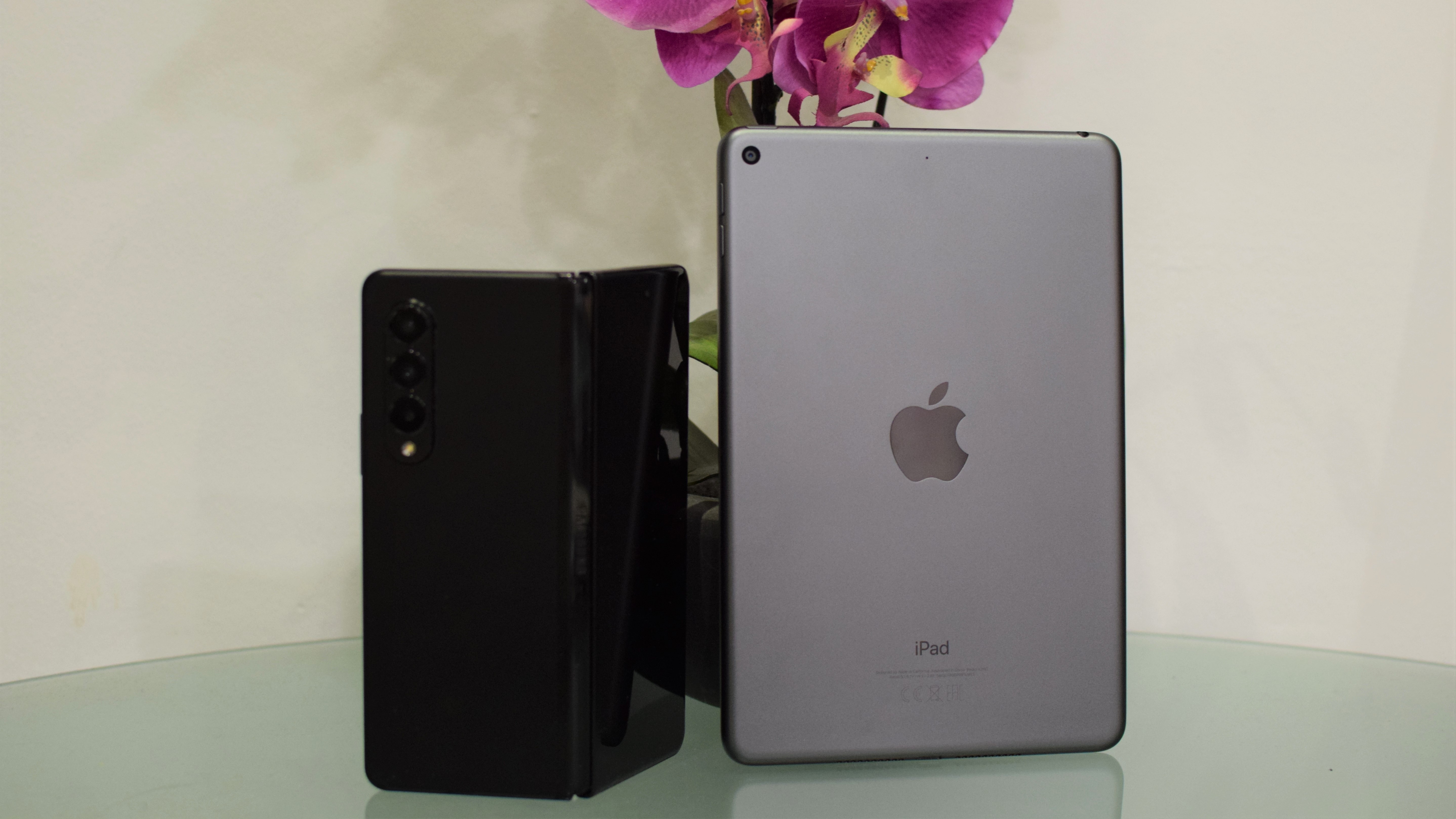 A photo of a Samsung Galaxy Z Fold 3 by an iPad mini 5