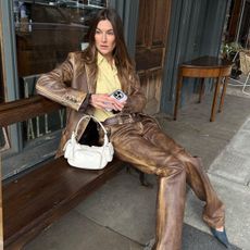 An image of @camillecharriere carrying the Miu Miu pocket bag, one of the best Miu Miu bags.