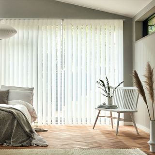 White vertical blinds in bedroom