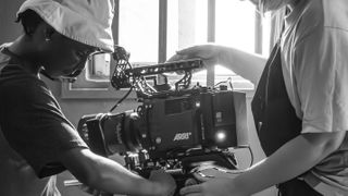 two people rigging up a ARRI Alexa 35