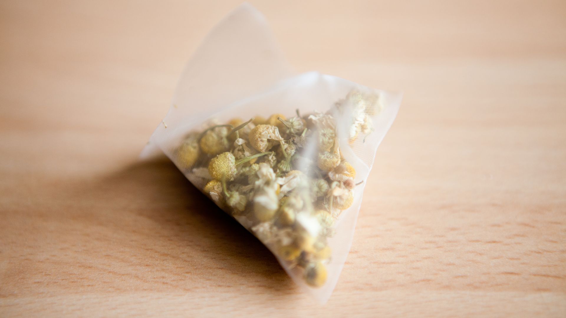 picture of a teabag with dried chamomile