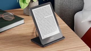 Amazon Kindle Paperwhite Signature Edition ereader on a wireless charger
