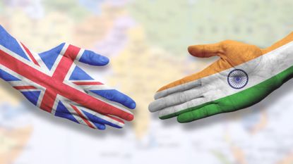 Union Jack and Indian flag colours in handshake