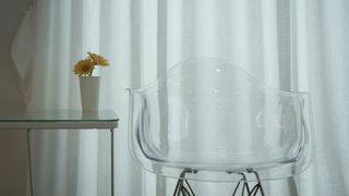 A see-through plastic looking chair