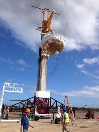 In this picture, NASA’s saucer-shaped experimental flight vehicle is prepared for a Range Compatibility Test at the US Navy’s Pacific Missile Range Facility in Kaua‘i, Hawaii. During the exercise, which occurred on April 23, 2014, all the radio frequencies interfaces between the vehicle, its balloon carrier and the missile range were checked.