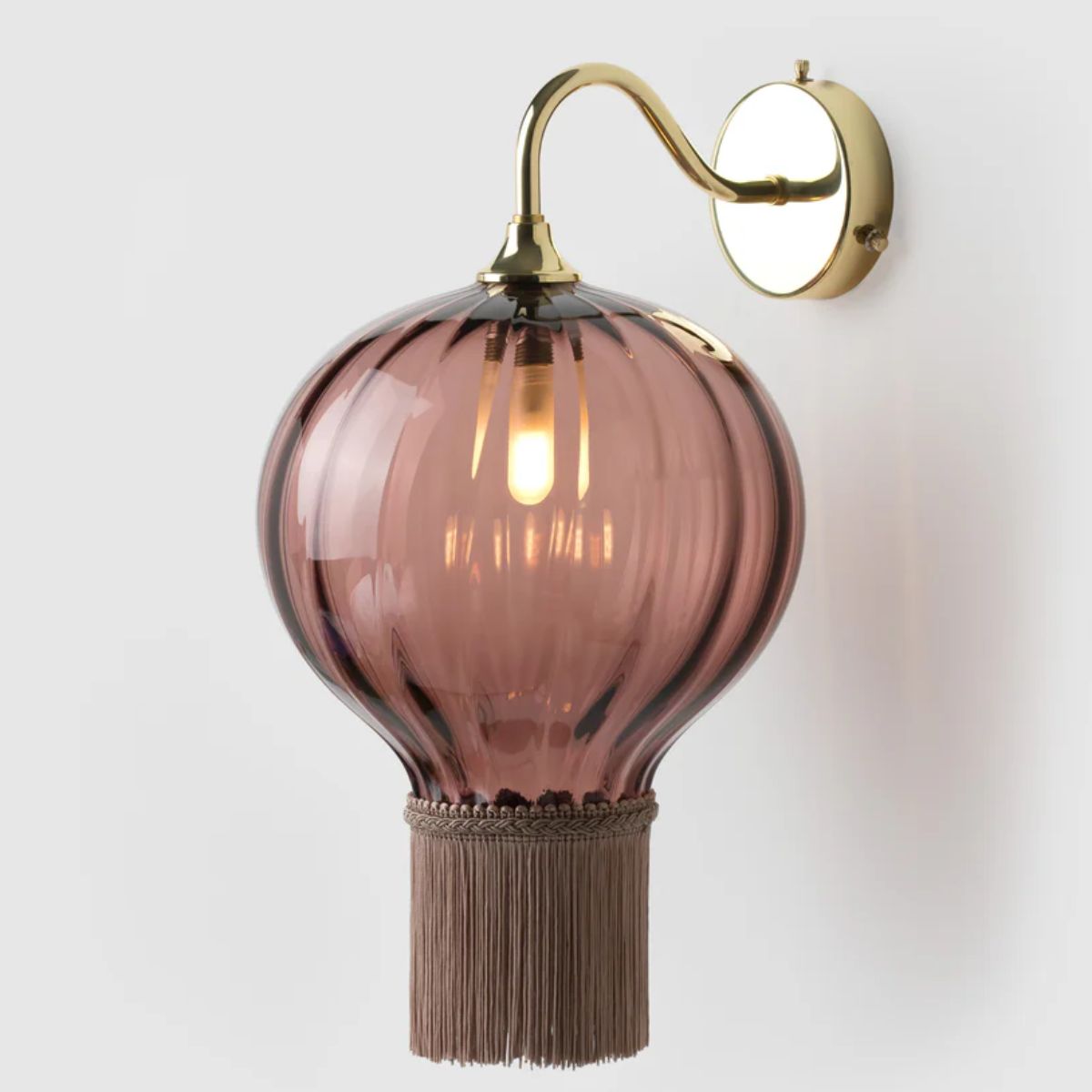 Pink glass opulent wall light with tassels