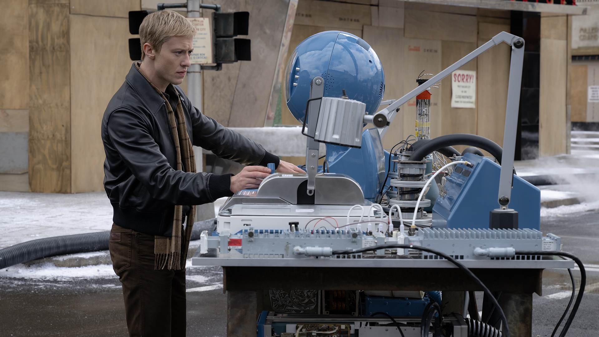 Johnny Storm using a scientific device in The Fantastic Four: First Steps