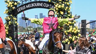 Robbie Dolan milking the applause at Flemington Racecourse after riding Knight's Choice to victory in the Melbourne Cup in 2024