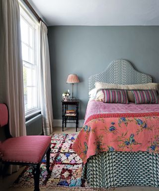 Blue bedroom with pink headboard