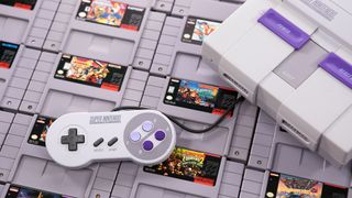 SNES på en samling spelkasetter.