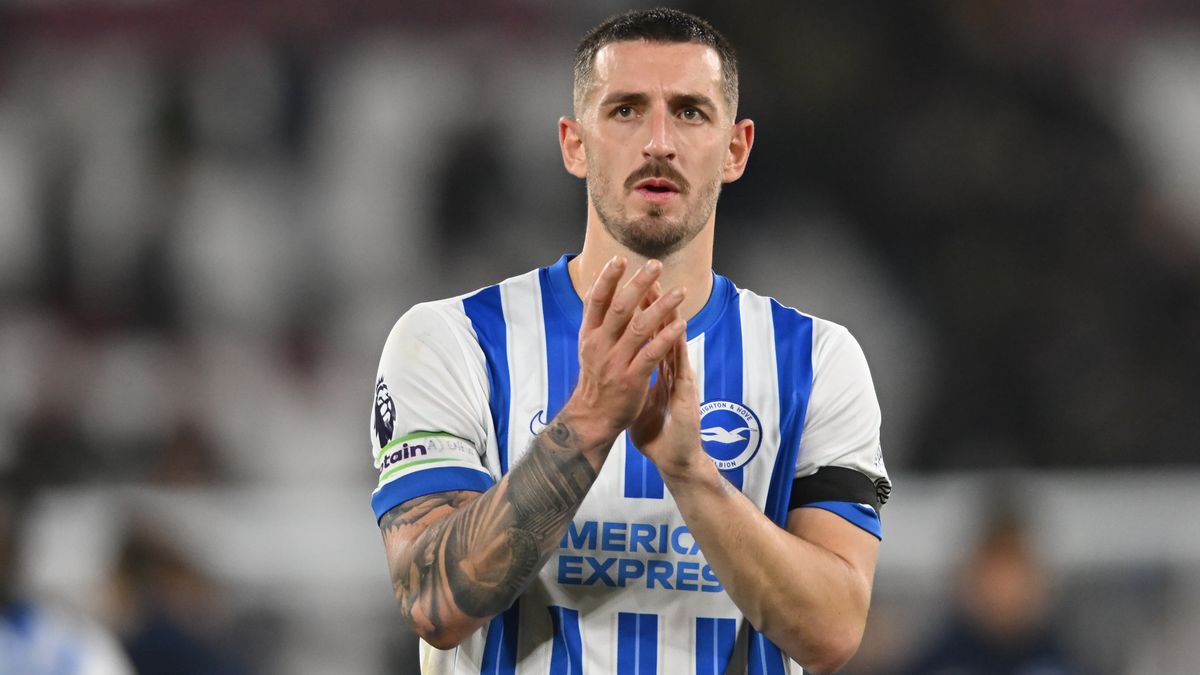 Lewis Dunk of Brighton applauds fans during a Premier League game