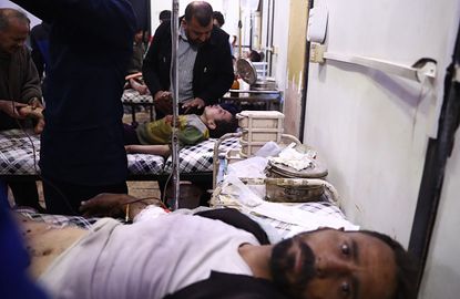 Syrian hospital patients receive treatment in Douma, outside Damascus, on April 3.