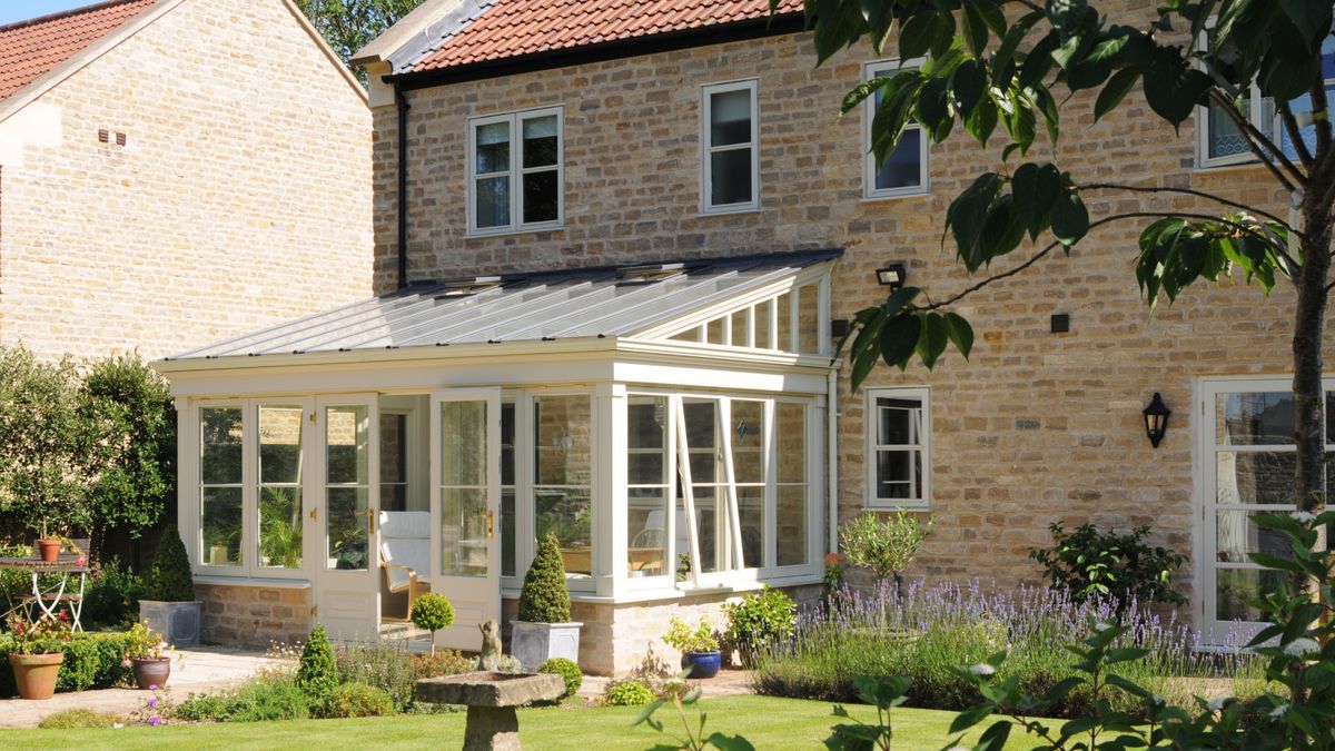 cream framed lean-to conservatory with solid roof