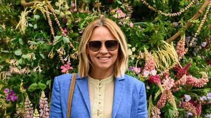 Kimberley Walsh wearing sunglasses and a blue blazer