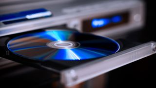 Can DVD players play Blu-ray discs? image shows a blu ray or DVD disc in a DVD player