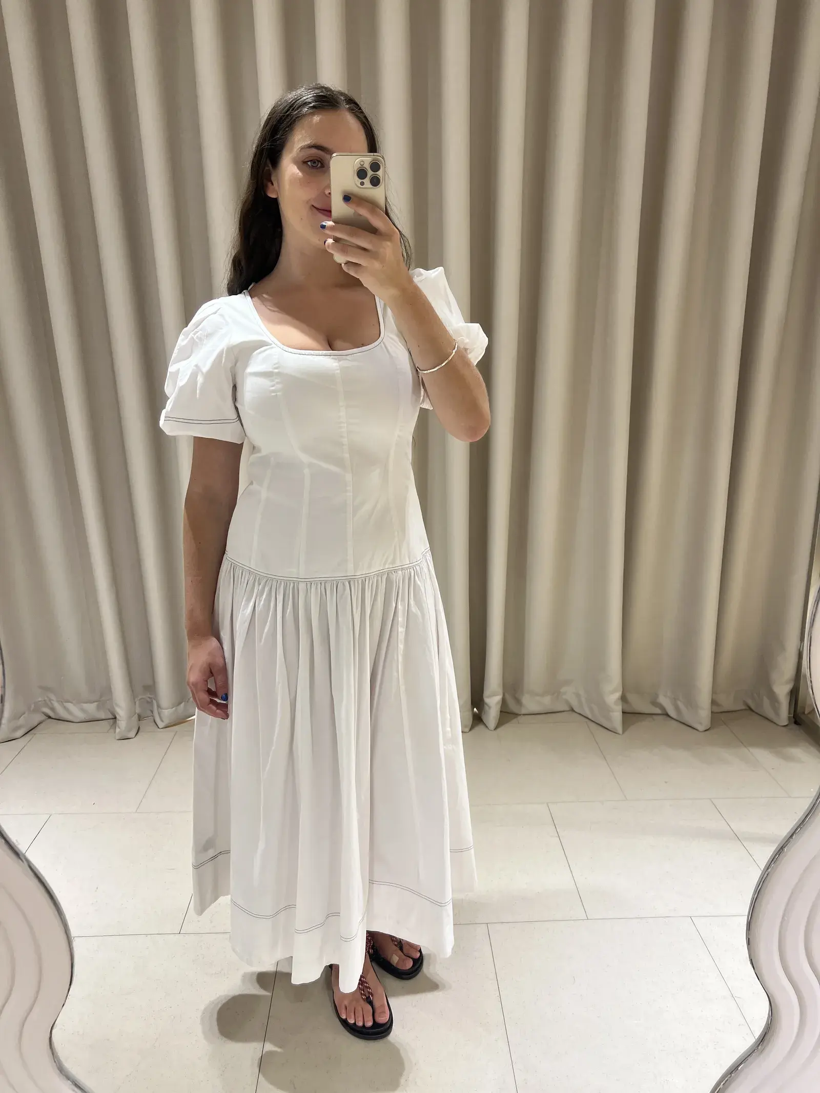 SEO writer Ava Gilchrist wears the M&S Pure Cotton Drop Waist Midi Waist Dress.