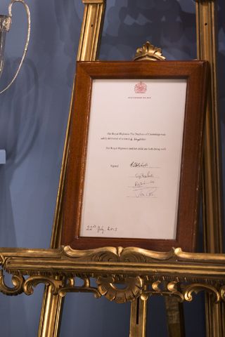 The certificate marking the birth of Prince George is displayed in a new exhibition exploring 250 years of royal childhood in Buckingham Palace
