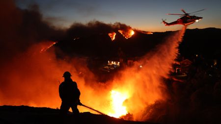 Firefighters respond to wildfires in the Pacific Palisades, California, on January 7.