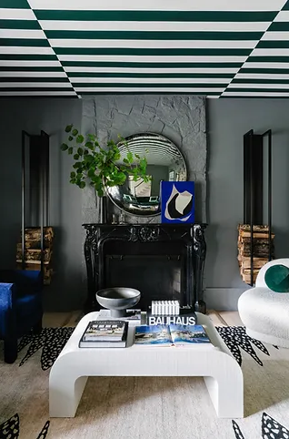 Dark living room with blue and green accents
