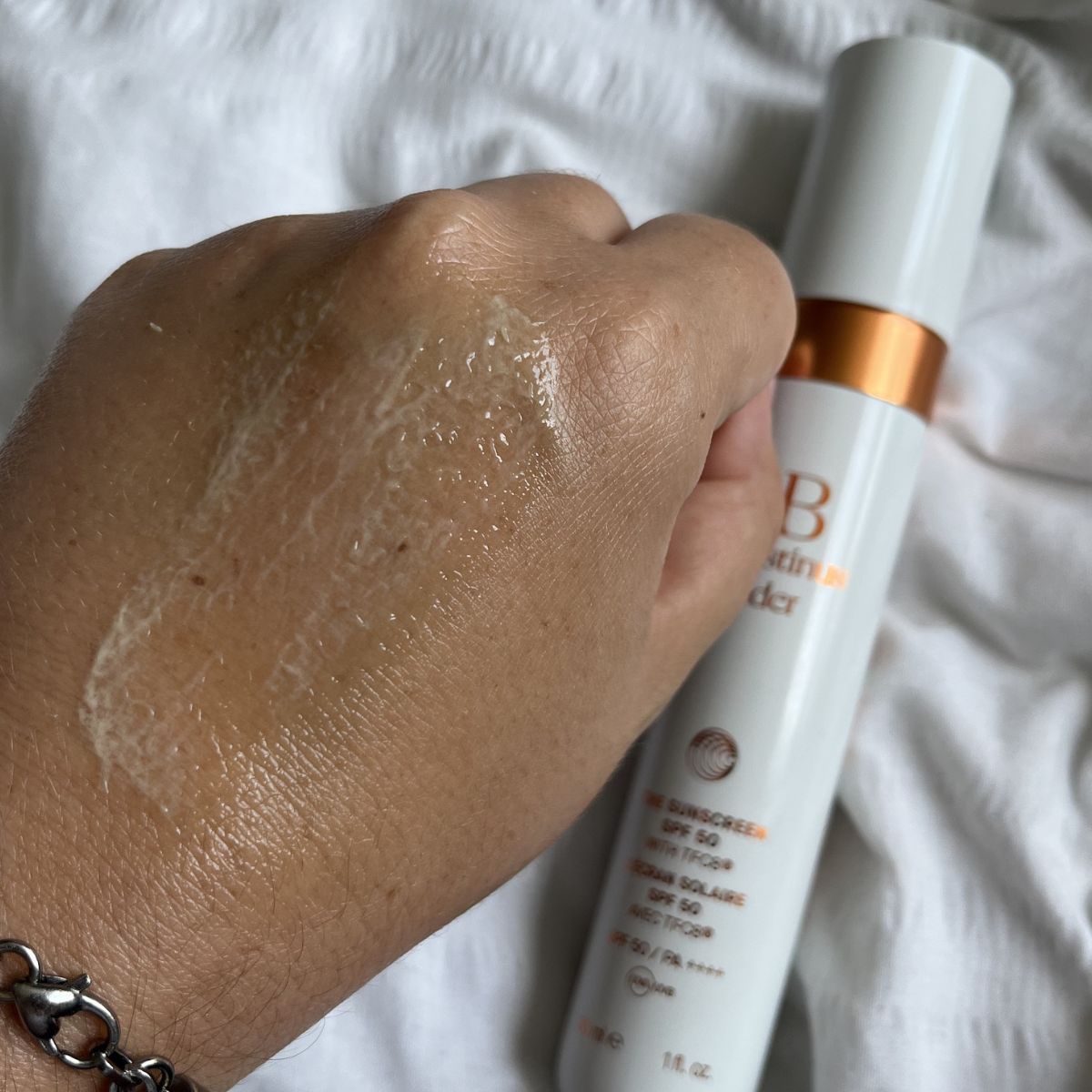 Augustinus Bader the Sunscreen Spf50 swatch on the back of a hand