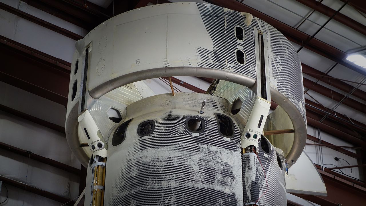 The Blue Origin New Shepard (NS-13) booster sensor experiment undergoes integration and testing at the company's West Texas launch facility.