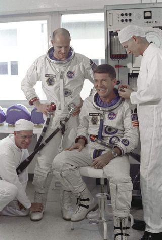 Schirra (seated) and Stafford snuck their instruments onto Gemini 6.