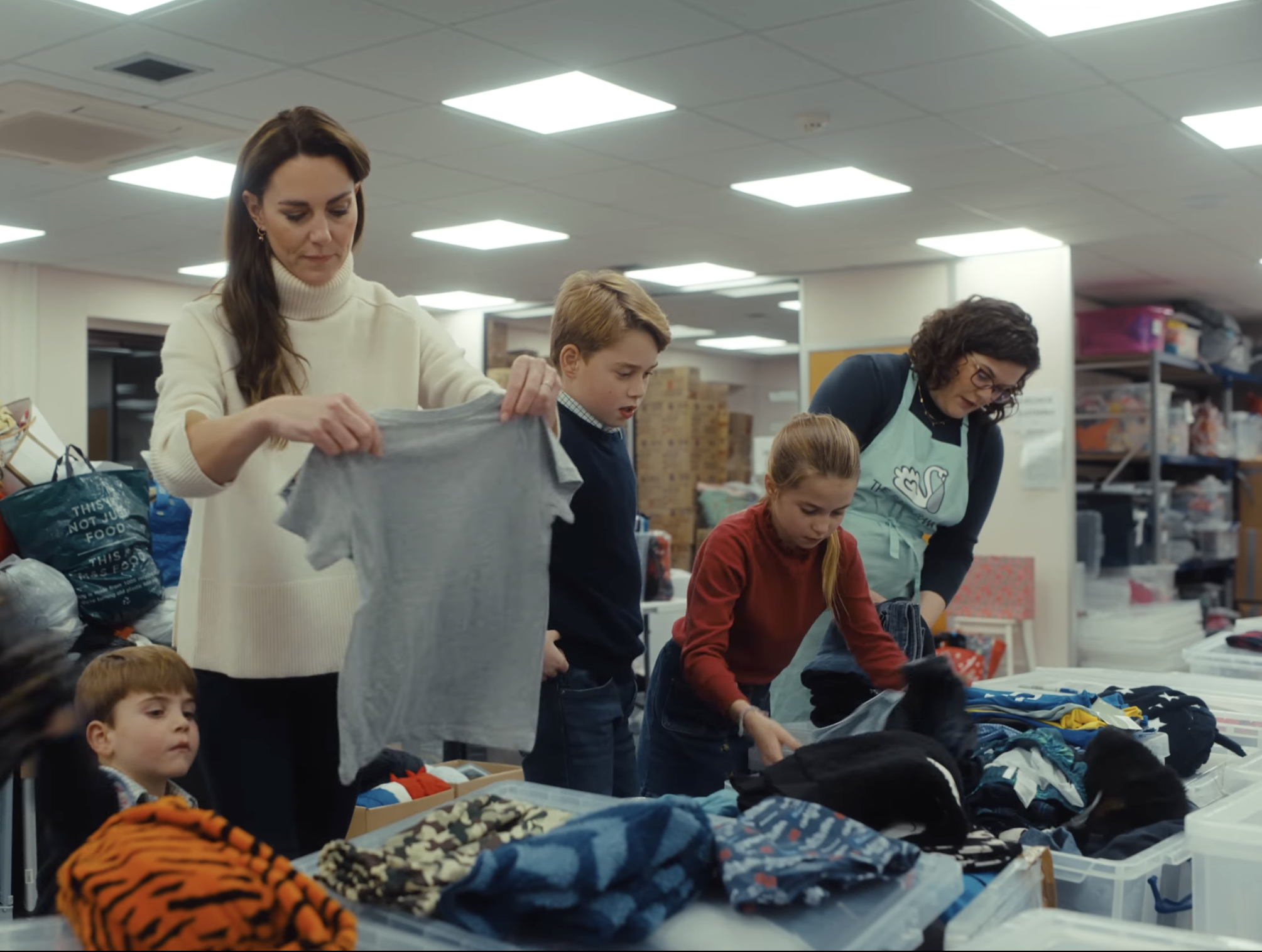 Prince George, Princess Charlotte, Prince Louis volunteering at a Baby Bank