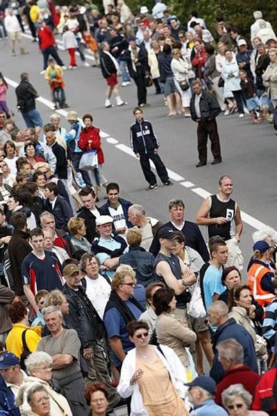 Fans look to see where the riders are