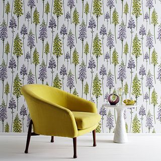 room with yellow chair and wallpaper
