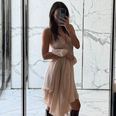 woman wearing knee high fitted boots