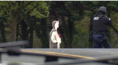 Baltimore police arrest man wearing animal onesie after possible bomb threat. 