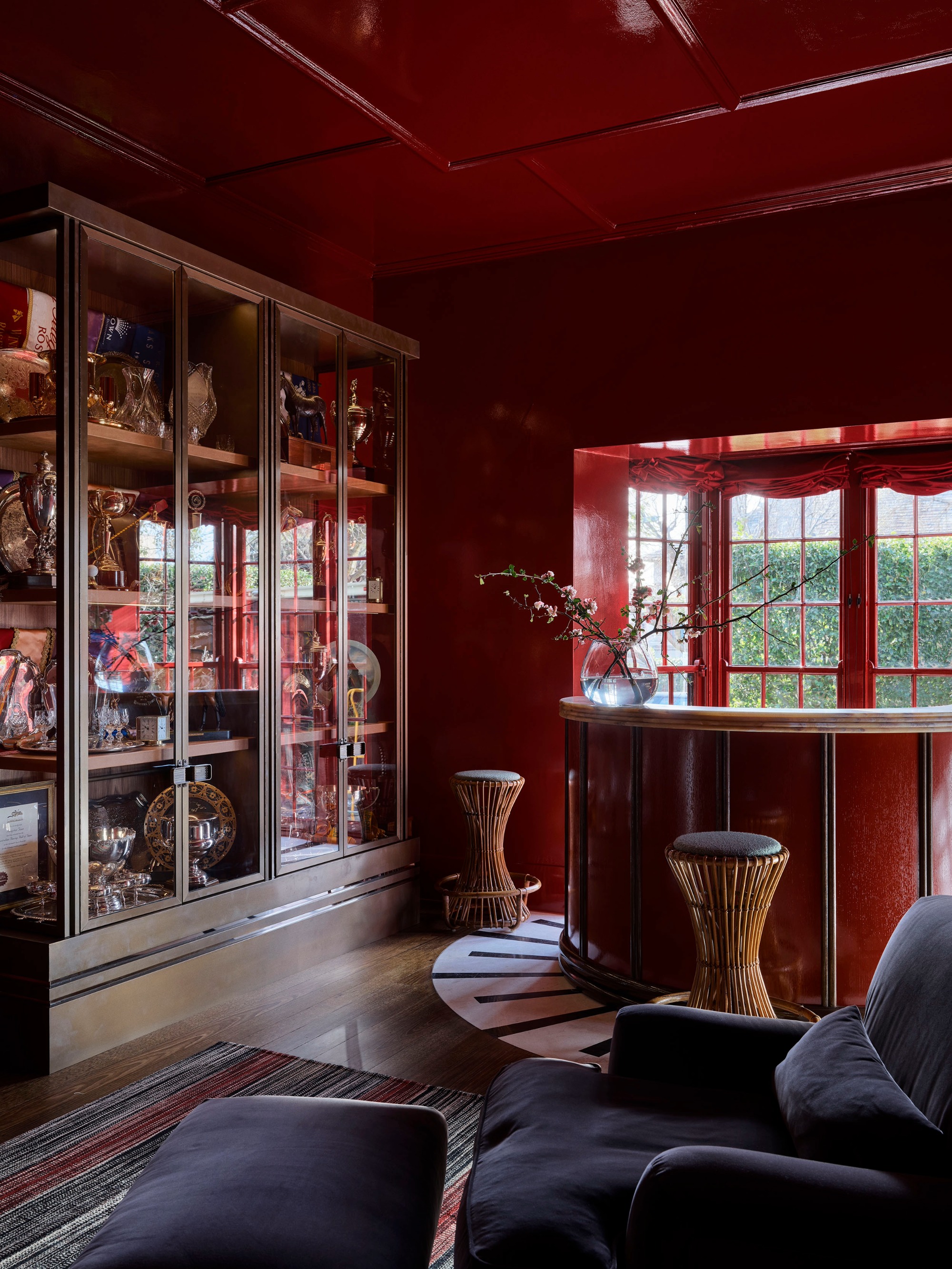 a red color drenched cocktail room