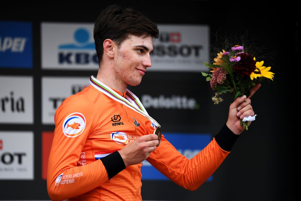 LEUVEN BELGIUM SEPTEMBER 24 Bronze medalist Olav Kooij of The Netherlands celebrates winning during the medal ceremony after the 94th UCI Road World Championships 2021 Men U23 Road Race a 1609km race from Antwerp to Leuven flanders2021 on September 24 2021 in Leuven Belgium Photo by Tim de WaeleGetty Images
