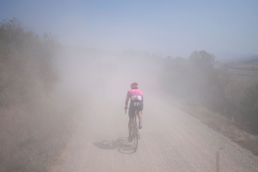 Team EF Canadian rider Micheal Woods pedals behind the pack on a dusty gravel road in the oneday classic cycling race Strade Bianche White Roads on August 1 2020 around Siena Tuscany Photo by MARCO BERTORELLO AFP Photo by MARCO BERTORELLOAFP via Getty Images