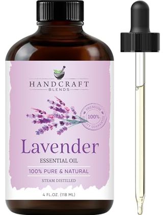 A brown glass bottle of Handcraft Blends Lavender Essential Oil with pink label and pipette