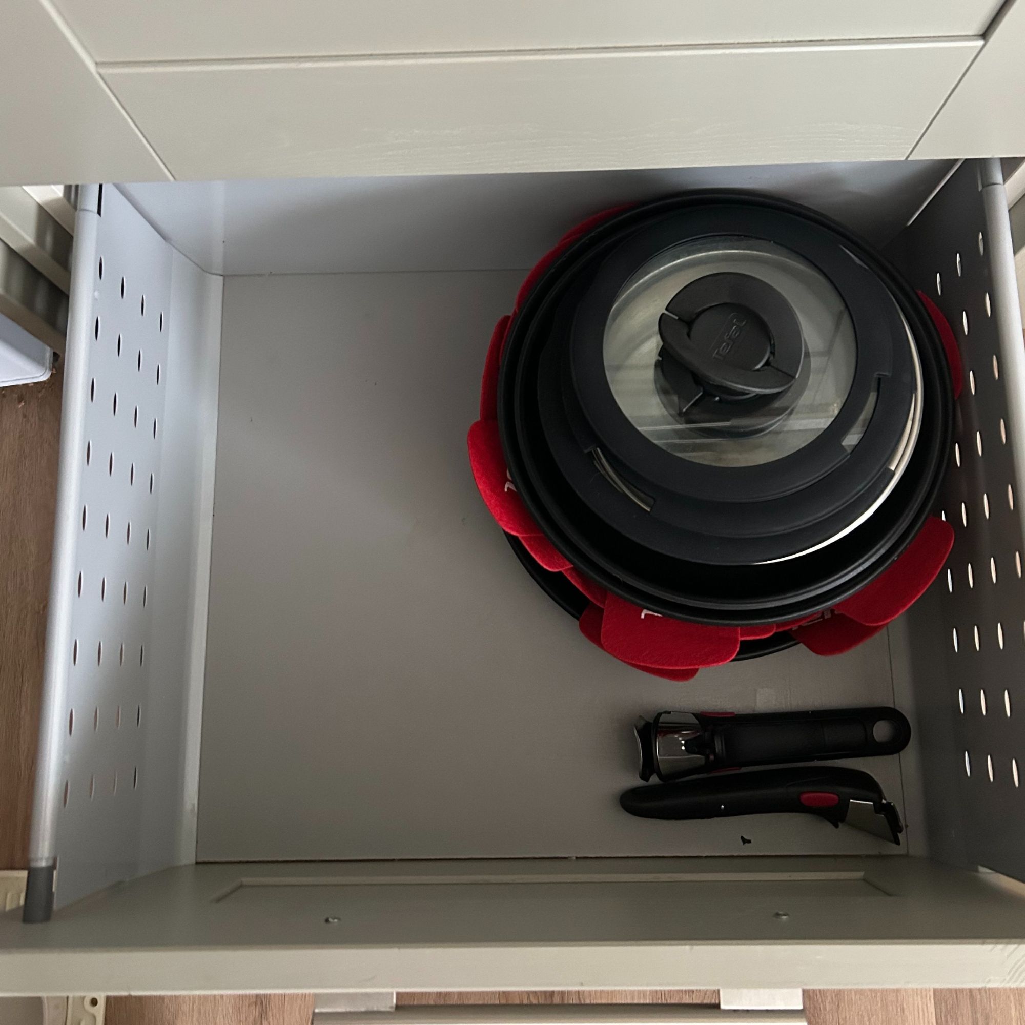 Tefal Ingenio Emotion 22-Piece Pan Set nestled in a drawer for storing