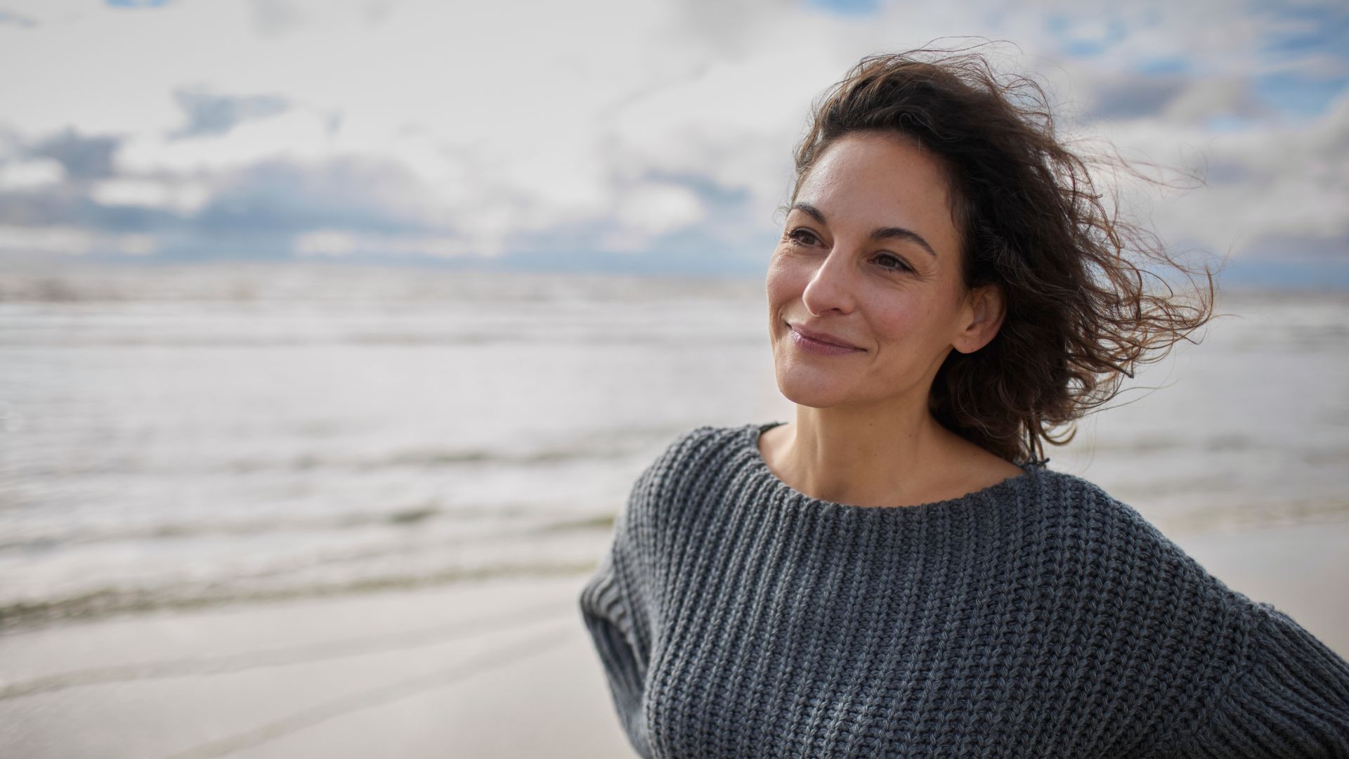 Woman smiling at the beach