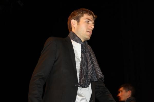 Maxime Monfort walks to the stage