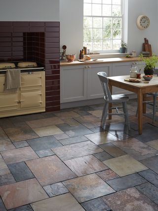 Colourful stone tiles in a traditional period kitchen cottage