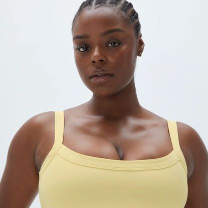 woman wearing one of the butter yellow athleisure picks from the article