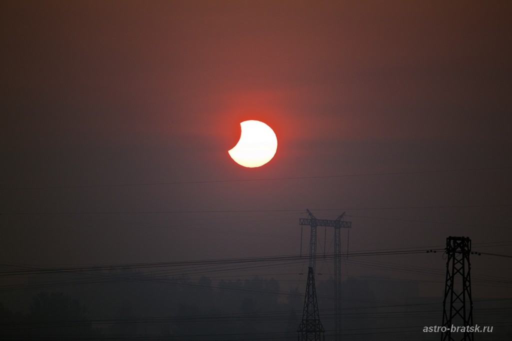 Photographer and skywatcher Svetlana Kulkova snapped this view of the partial solar eclipse of June 1-2, 2011 just after sunrise on June 2 from Bratsk, Russia. The partial solar eclipse was dubbed a &quot;midnight&quot; eclipse as its viewing path crossed the Inter